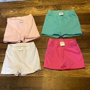 LOT: 4 pairs of Hanna Andersson girls shorts.Pink, teal, white, stretchy organic